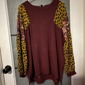 Chic Women's Burgundy Top with Animal Print Sleeves